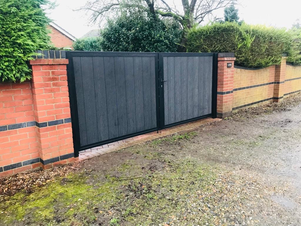 Composite double-leaf driveway gates installed Wales